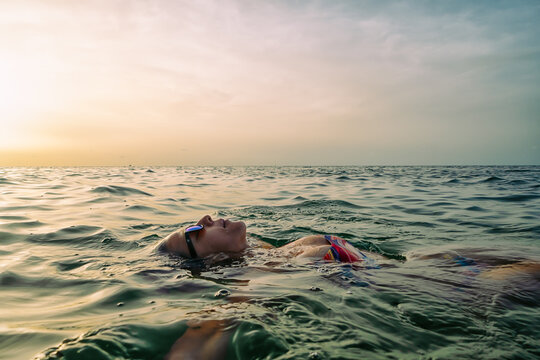 A woman is swimming in the ocean