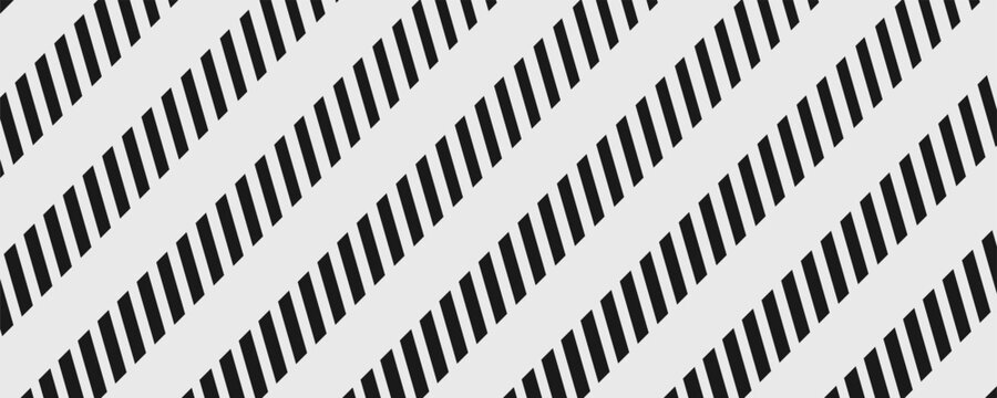 Abstract black diagonal stripes pattern on gray background. Forming geometric texture with high contrast lines and dynamic repetition.v