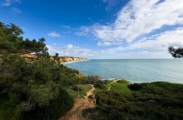 View of the sea and rocks of the beach of Olhos de Agua, Albufeira, Algarve, Portugal.
