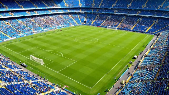 Soccer stadium with green field and blue seats