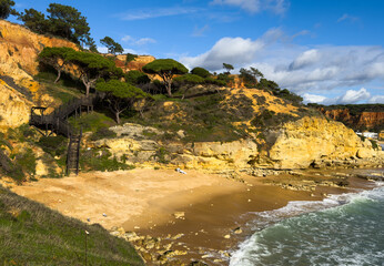 View of the sea and rocks of the beach of Olhos de Agua, Albufeira, Algarve, Portugal.