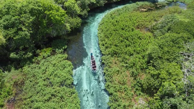 Aerial drone view of tourists on a boat tour in the crystalline Sucuri River in Bonito, Mato Grosso do Sul, Brazil