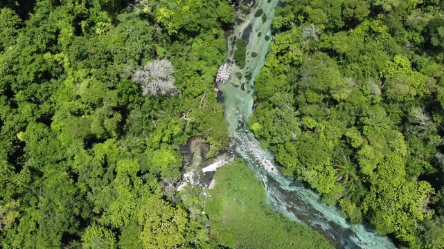 Aerial drone view of tourists on a boat tour in the crystalline Sucuri River in Bonito, Mato Grosso do Sul, Brazil
