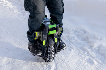 Person riding electric unicycle monowheel self-balancing personal transportation device on snowy winter terrain showing alternative eco-friendly urban mobility technology outdoor recreation activity © MarijaBazarova