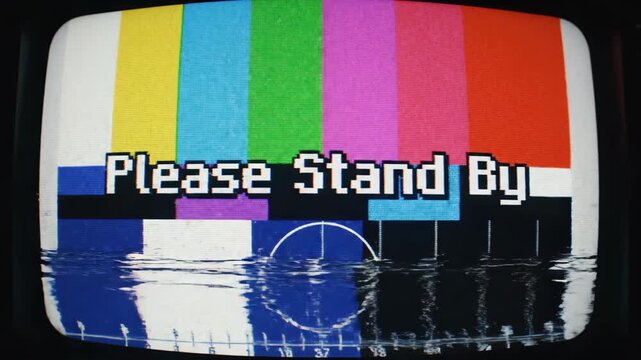 Vintage TV screen with Please Stand By message on colorful test pattern
