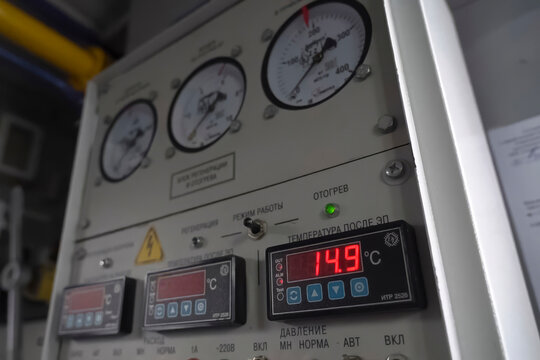 Pressure and temperature monitoring and control panels at gas condensate treatment plant.