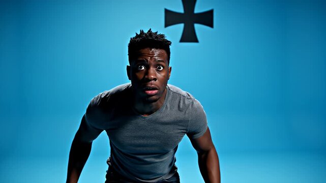 Close-up of a shocked man with wide eyes and open mouth against a blue background