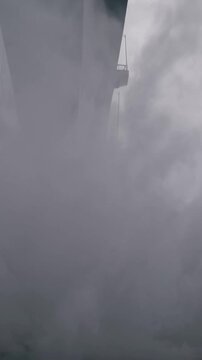 Misty structure with towering arches, Thick haze envelops massive support beams of bridge silence, Foggy atmosphere obscures grand architecture and underlying massive pillars of bridge