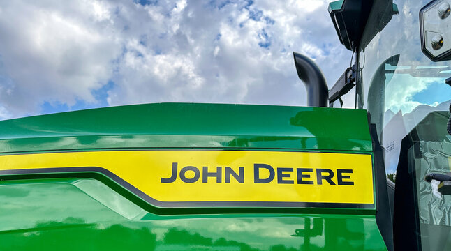 Close up of a John Deere tractor against blue sky - Fair Oaks, IN - May 12, 2025