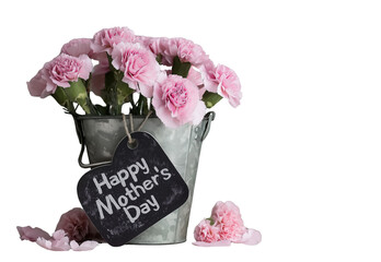 a rustic metal bucket filled with pink carnations, set against an old wooden table. a heart-shaped chalkboard sign is attached to the bucket that reads "happy mother's day" in elegant script. the back