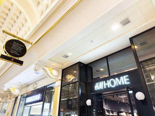 Naklejka premium Luxurious shopping arcade interior at The Trafford Centre Manchester featuring Samsung and H M Home stores