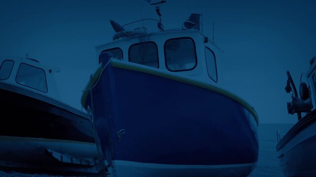 Fishing Boats On The Shore At Dusk