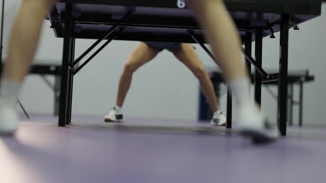 Low angle view of table tennis players' footwork
