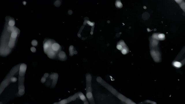 Super Slow Motion Shot of Real Glass Shards Falling on Camera Lens Below at 1000 fps.