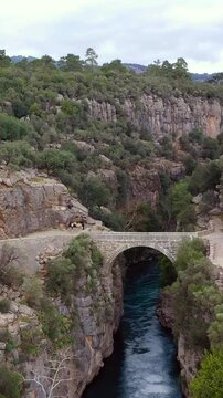 Oluk stone bridge in Koprulu canyon over K&ouml;pr&uuml;&ccedil;ay river, drone video, Manavgat, Antalya, T&uuml;rkiye.