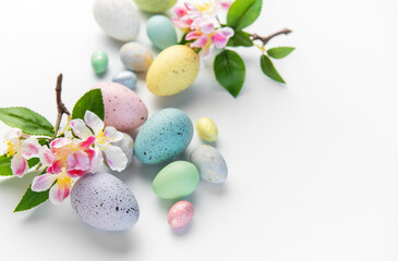 Pastel colored eggs and plum blossoms for easter