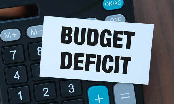 Budget Deficit Note on Calculator with American Flag: National Debt, Fiscal Policy, and Economy