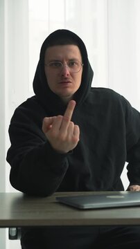 Against the rules.
A person protests by showing the middle finger.
An obscene finger gesture.