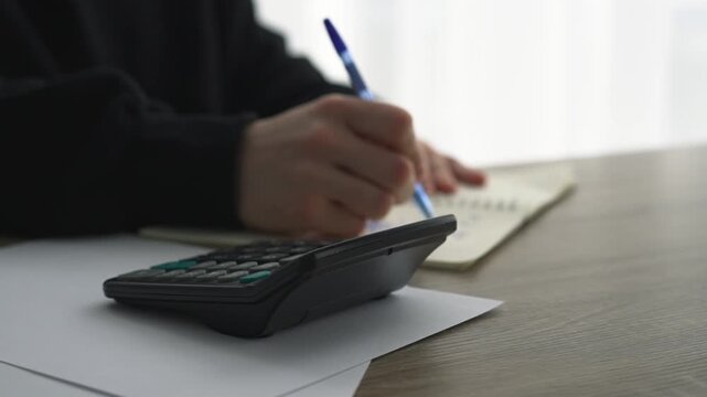 Working at a bank.
A businessman calculates profits.
Budget allocation for a period.
Financial transactions