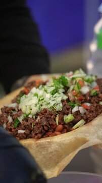 Vertical video Salsa and Toppings Added to Asada Burrito, slow motion, close up &ndash; Street Food Detail 