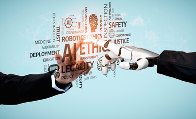 A human hand reaching out to a robotic hand symbolizes the intersection of ethics and technology,...