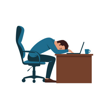 A tired businessman sleeping at his desk in front of a laptop computer