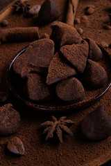 healthy delicious chocolate truffles around ingridients with natural cocoa beans,  powder. healthy sweets concept. flat lay
