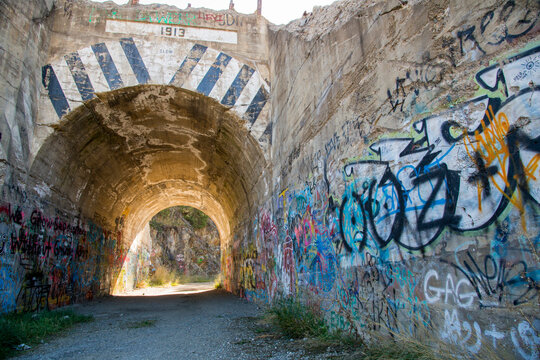 Canada, BC, Greenwood.  Old abandoned one lane road tunnel. Covered in graffiti.