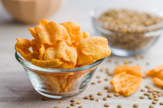 Crispy lentil chips on kitchen table.