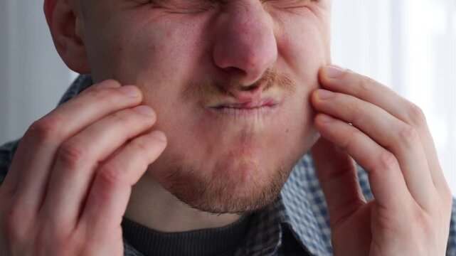 puffed-out cheeks on his face.
The man holds his breath for a long time.
A mouthful of air