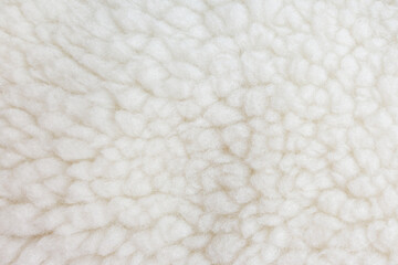 White fleece fabric texture close up background © Iryna Miadzvedzeva