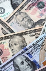 Big pile of US dollar bills in various nominations. United States money banknotes