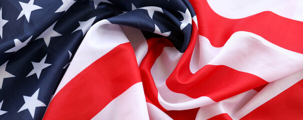 Official flag of United States of America with folds and waves close up. Patriotic background