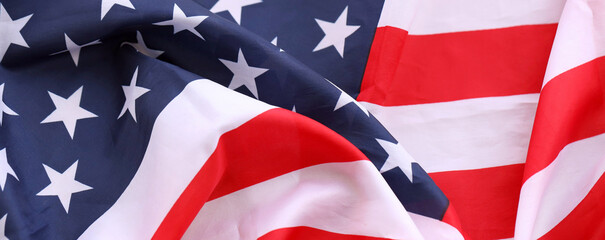 Official flag of United States of America with folds and waves close up. Patriotic background