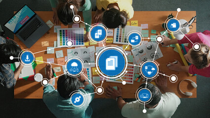 Engaging overhead view of a diverse team participating in a productive brainstorming session,...