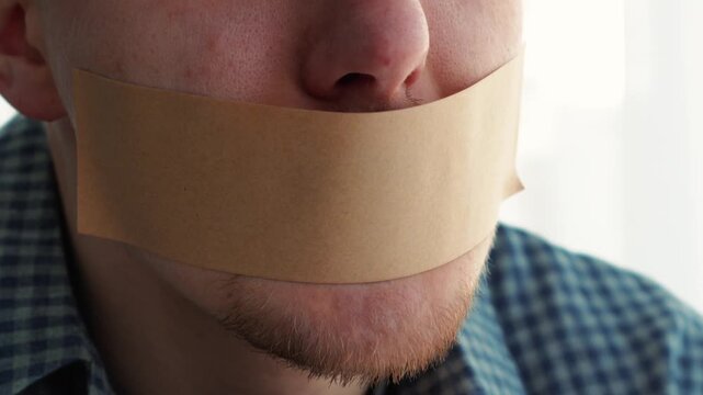 Close-up of sticky tape on lips