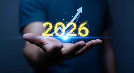 A person holding the year 2026 with a rising arrow