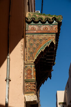 Ornately carved wooden lintel above a door in the medina, in Meknes, Morocco