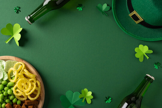 Vibrant St Patrick's Day setting featuring a green backdrop, decorative shamrocks, a leprechaun hat, beer bottles, and a platter of snacks for a festive greeting and celebration