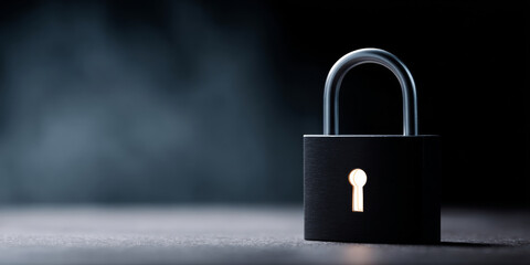 Naklejka premium Black padlock with glowing keyhole