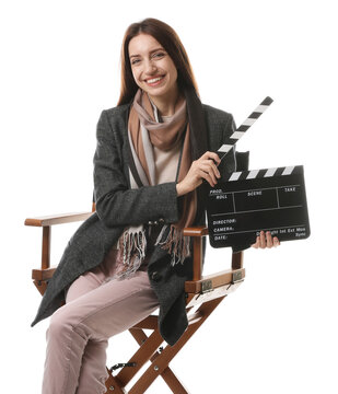Professional film director with clapperboard on chair against white background