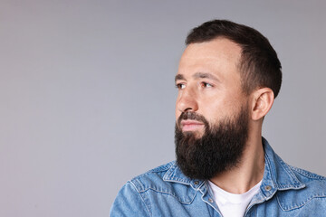 Obraz premium Man with mustache and beard on light grey background. Space for text