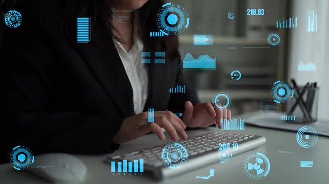 A business professional types on a keyboard in a modern workspace, surrounded by digital data graphics. This image represents technology, innovation, and corporate efficiency.