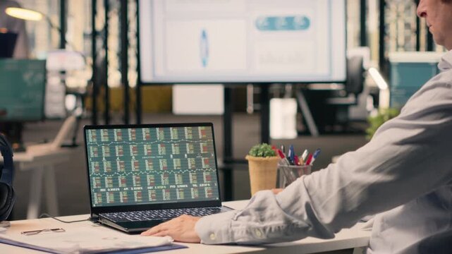 Professional man, business intel, visual data in office, analytics dashboard, performance metrics, forecasting reports, assisting with monetary data, resource allocation, and strategy planning.
