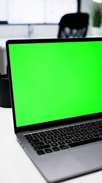Office Environment with over the shoulder shot of caucasian woman looking at green screen chroma key person using laptop computer mockup distortion, overlay, glitch, static noise, scan lines on black