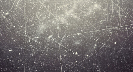 Abstract Background of Dark Scratched Surface with White Specks and Lines