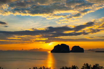 Aerial view sunset sky,Nature beautiful Light Sunset or sunrise over sea,Colorful scenery sunset Panorama Sky with Amazing clouds and waves in the ocean golden light cloud background