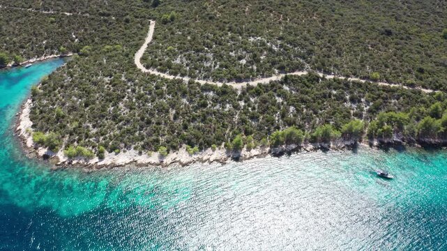 4K Flying drone footage showing picturesque Croatian islands, harbors beaches and yachts on aquamarine sea. Holidays, traveling, summer vacation, exploring, environment concept. Sibenik, Croatia.