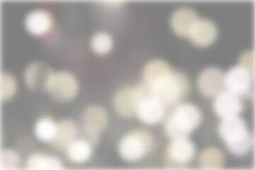 Fototapeta premium Una toma de cerca de una fondo abstracto de luces de navidad de diferentes colores en la oscuridad. Desenfoque bokeh