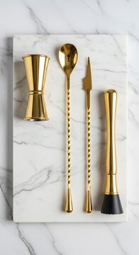 Gold Barware Tools on Marble Surface.